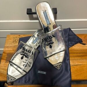 PRADA
Logo Vinyl & Leather Pointy-toe Sandal In clear /silver size 7